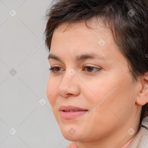 Joyful white young-adult female with short  brown hair and brown eyes