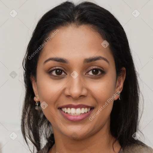 Joyful latino young-adult female with long  brown hair and brown eyes