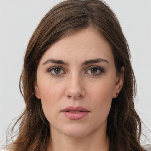 Neutral white young-adult female with long  brown hair and brown eyes