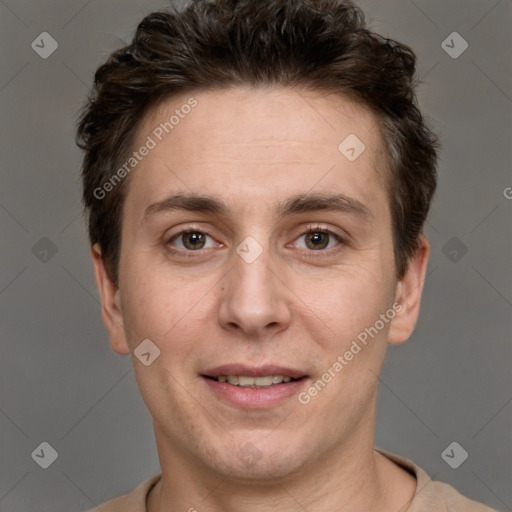 Joyful white adult male with short  brown hair and grey eyes