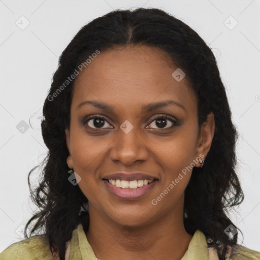 Joyful black young-adult female with long  brown hair and brown eyes