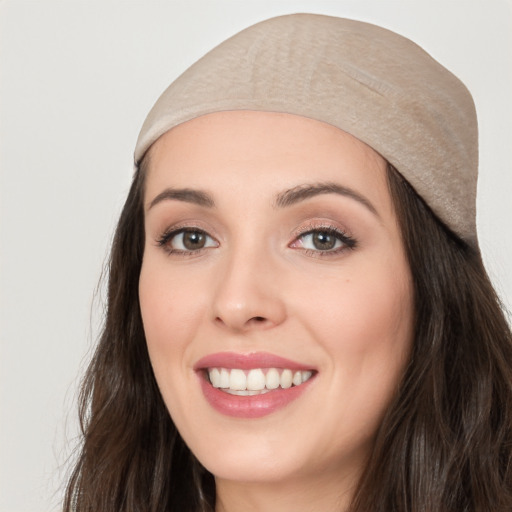 Joyful white young-adult female with long  black hair and brown eyes