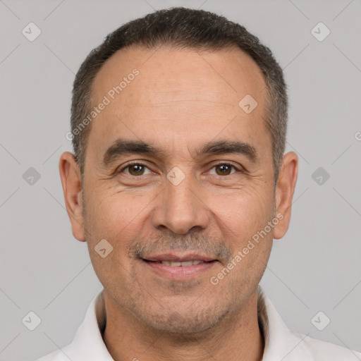 Joyful white adult male with short  brown hair and brown eyes