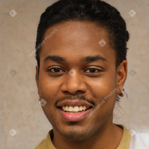 Joyful black young-adult male with short  brown hair and brown eyes