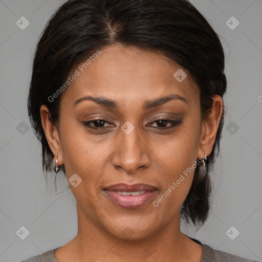 Joyful latino young-adult female with medium  brown hair and brown eyes