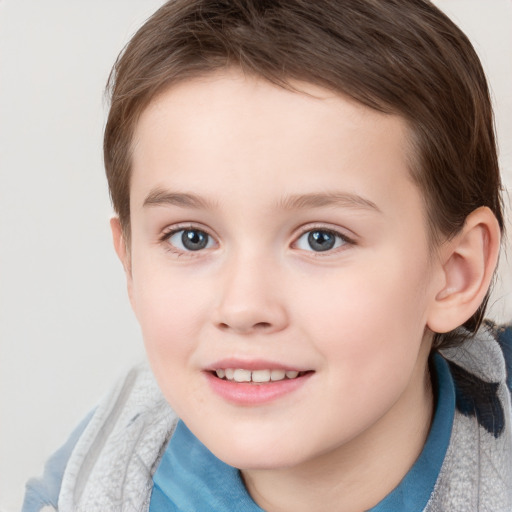 Joyful white child female with short  brown hair and grey eyes