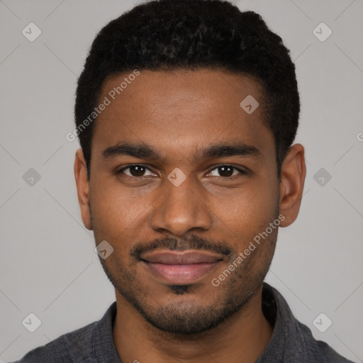 Joyful black young-adult male with short  brown hair and brown eyes