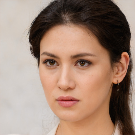 Neutral white young-adult female with medium  brown hair and brown eyes