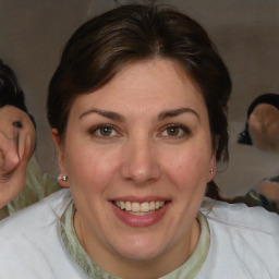 Joyful white adult female with medium  brown hair and brown eyes