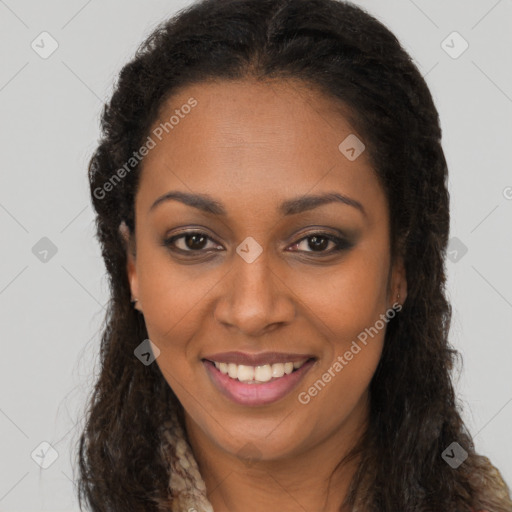 Joyful black young-adult female with long  brown hair and brown eyes