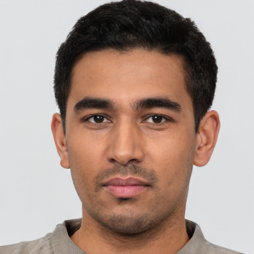 Neutral latino young-adult male with short  black hair and brown eyes