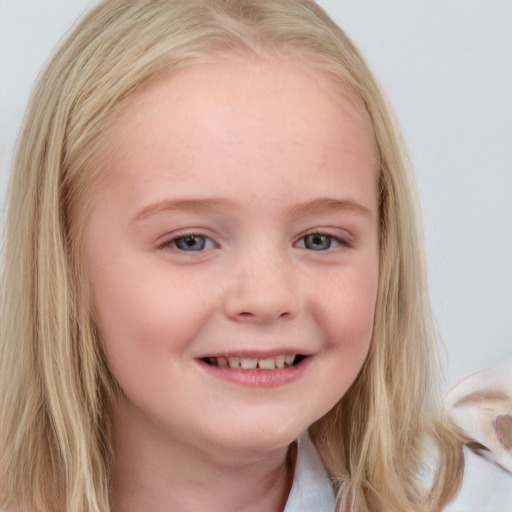 Joyful white child female with medium  blond hair and blue eyes