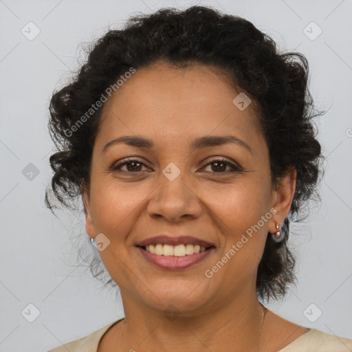 Joyful latino adult female with short  brown hair and brown eyes