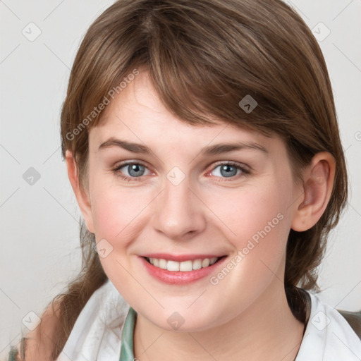 Joyful white young-adult female with medium  brown hair and blue eyes