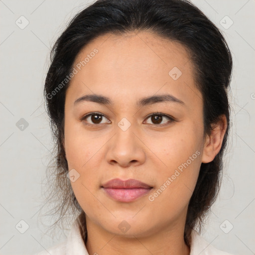 Joyful latino young-adult female with medium  brown hair and brown eyes