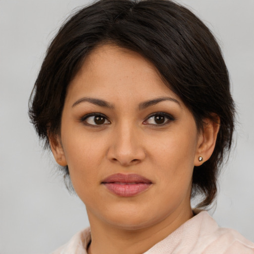 Joyful asian young-adult female with medium  brown hair and brown eyes
