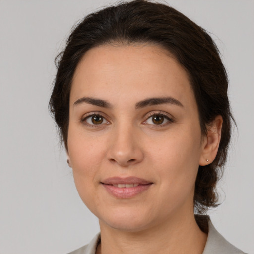 Joyful white young-adult female with medium  brown hair and brown eyes