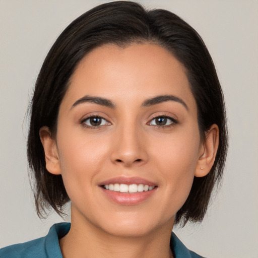 Joyful white young-adult female with medium  brown hair and brown eyes