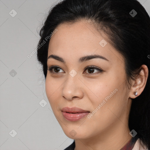 Joyful latino young-adult female with medium  brown hair and brown eyes