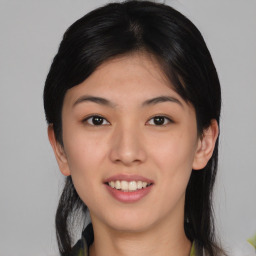 Joyful asian young-adult female with medium  black hair and brown eyes