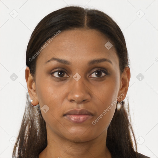 Joyful black young-adult female with long  brown hair and brown eyes