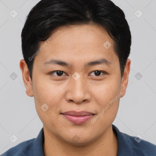 Joyful asian young-adult male with short  brown hair and brown eyes