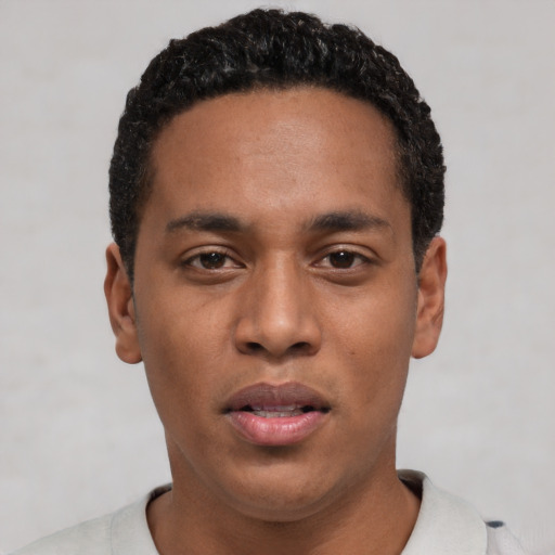 Neutral black young-adult male with short  black hair and brown eyes
