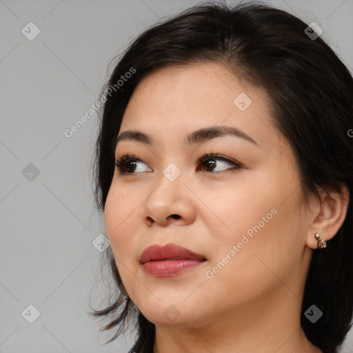 Joyful asian young-adult female with medium  brown hair and brown eyes