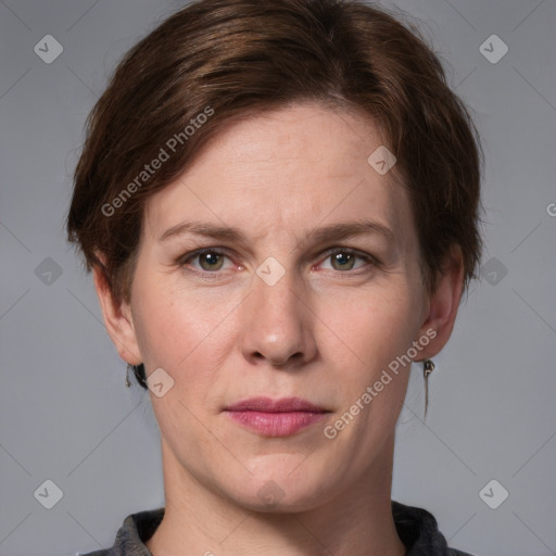 Joyful white adult female with medium  brown hair and grey eyes