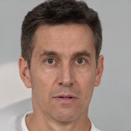 Neutral white adult male with short  brown hair and brown eyes