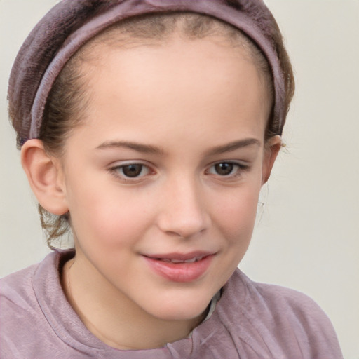 Joyful white child female with short  brown hair and brown eyes