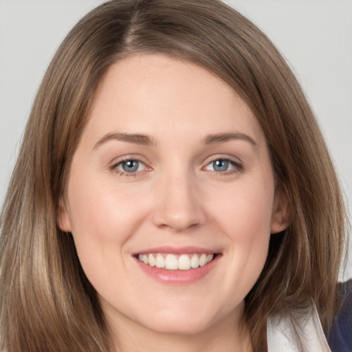 Joyful white young-adult female with long  brown hair and grey eyes