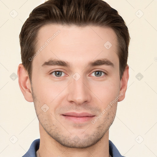 Joyful white young-adult male with short  brown hair and grey eyes