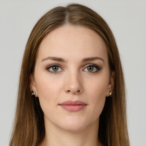 Neutral white young-adult female with long  brown hair and green eyes