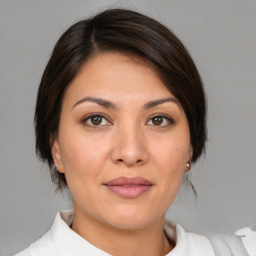 Joyful white young-adult female with medium  brown hair and brown eyes