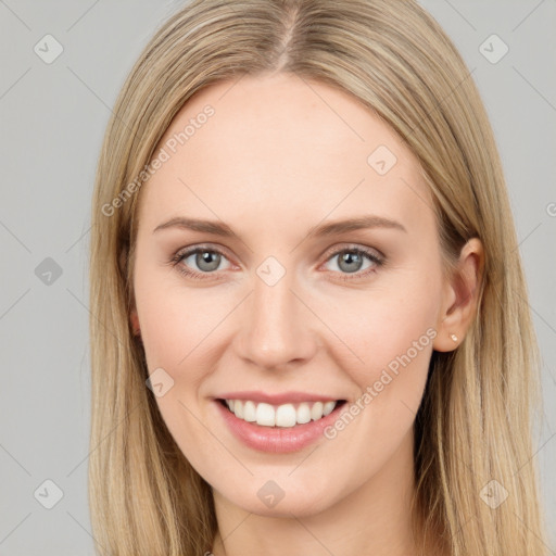 Joyful white young-adult female with long  brown hair and grey eyes