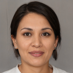 Joyful white young-adult female with medium  brown hair and brown eyes