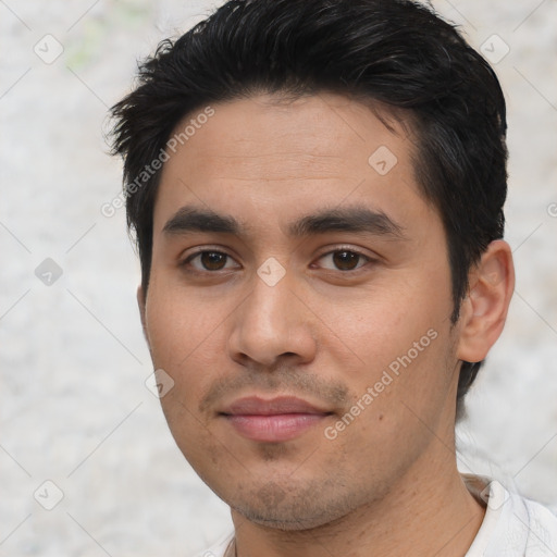 Joyful asian young-adult male with short  black hair and brown eyes