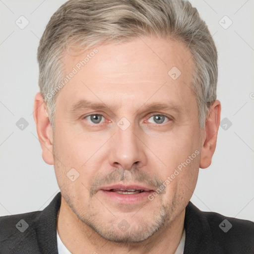 Neutral white adult male with short  brown hair and grey eyes