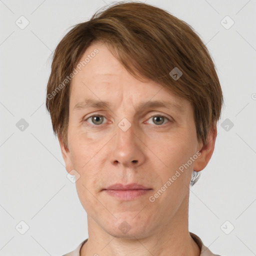 Joyful white adult male with short  brown hair and grey eyes