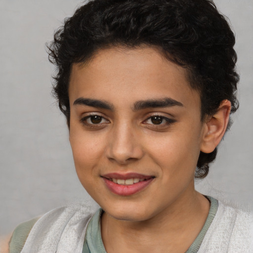 Joyful latino young-adult female with short  brown hair and brown eyes