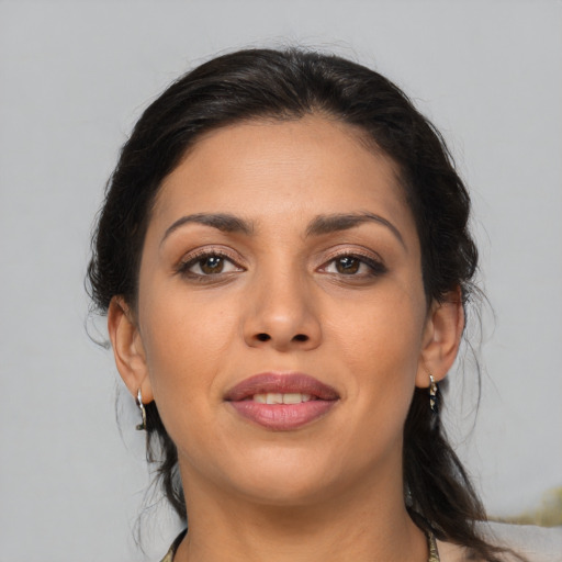 Joyful asian young-adult female with medium  brown hair and brown eyes