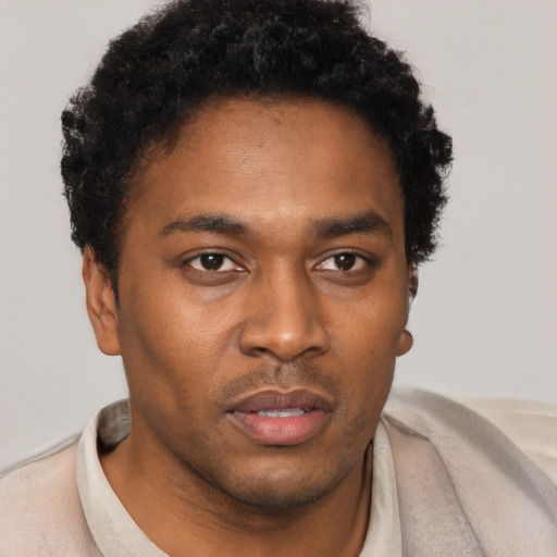 Neutral black young-adult male with short  brown hair and brown eyes