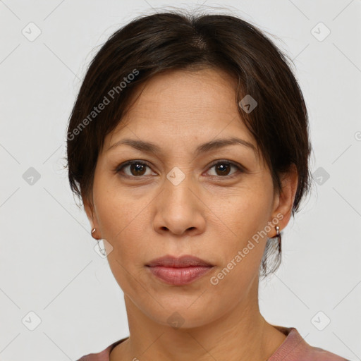 Joyful white adult female with short  brown hair and brown eyes