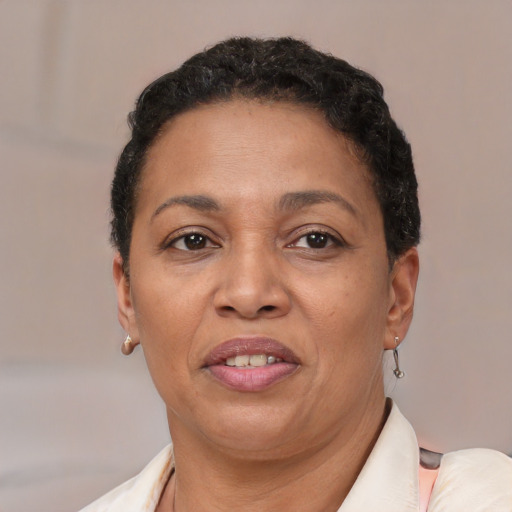 Joyful latino adult female with short  brown hair and brown eyes