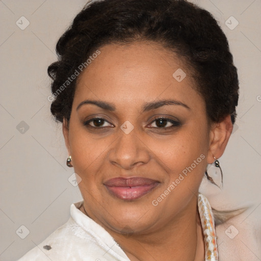 Joyful latino adult female with short  brown hair and brown eyes