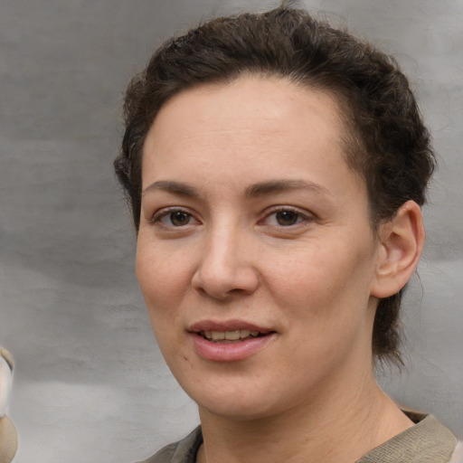 Joyful white adult female with short  brown hair and brown eyes