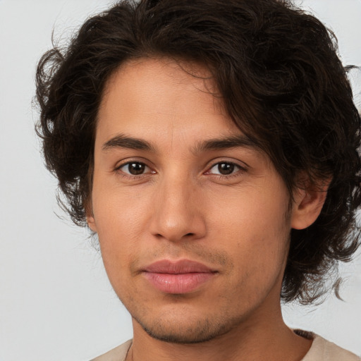 Joyful white young-adult male with medium  brown hair and brown eyes