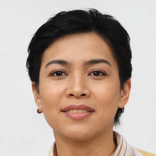 Joyful asian young-adult female with short  black hair and brown eyes