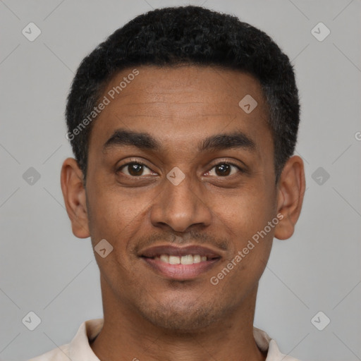 Joyful latino young-adult male with short  black hair and brown eyes